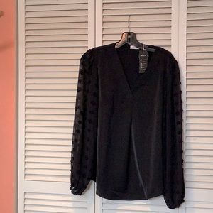 Black woman’s size large  V neck blouse with lantern sleeve Swiss dot.